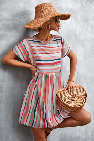Striped trapeze dress with yoke seam in coral, navy, and grey stripes.