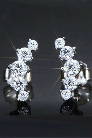 Silver stud earrings with a cascading cluster of round cubic zirconia stones.