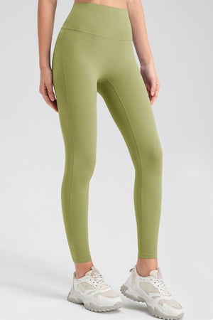 Matcha green high-waist performance leggings with sculpting seams.