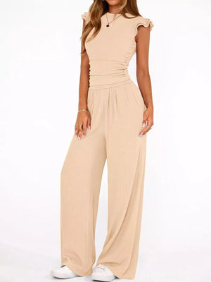 Apricot maternity two-piece ensemble with ruffled cap sleeves and ruched waist.