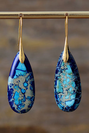 Ocean Jasper dangle earrings in blue/gold with teardrop stones and gold hooks.