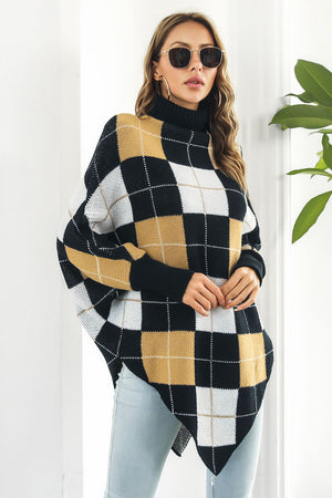 Geometric knit turtleneck cape sweater in plaid pattern with acrylic material.