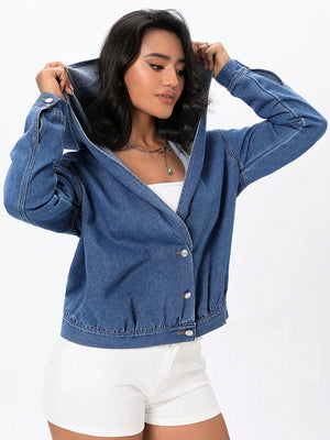 Medium wash denim bomber jacket with hood and button closure.