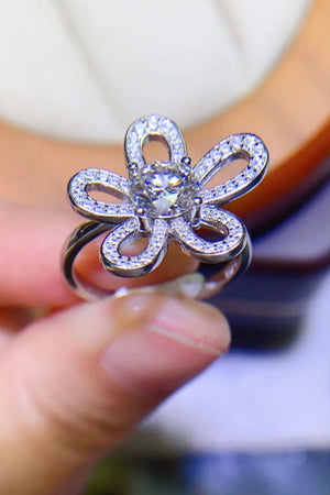 White moissanite flower ring with pavé petal details.