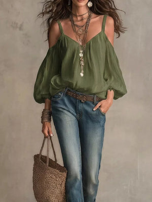 Army green cold shoulder shirt with balloon sleeves and V-neck, styled with jeans and jewelry.