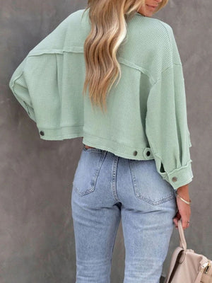 Waffle knit cropped utility jacket in moss green with button details and a relaxed fit.