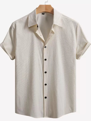 Off-white textured cotton Cuban collar short sleeve casual shirt with black buttons.