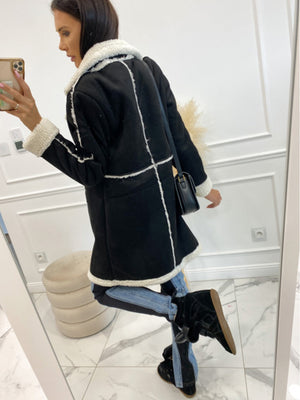 Black suede effect overcoat with white shearling trim and collar, long sleeves.