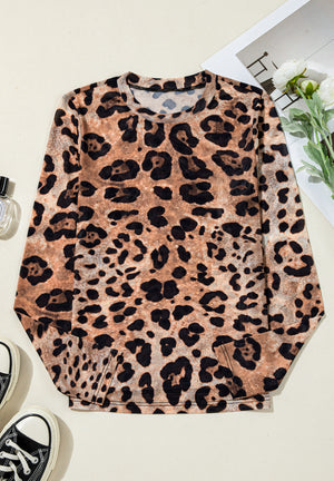 Sheer leopard print long sleeve blouse with a crew neck.