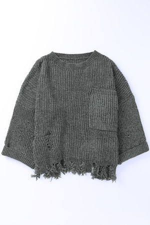 Distressed dark gray knit sweater with crew neck, chest pocket, and frayed hem.