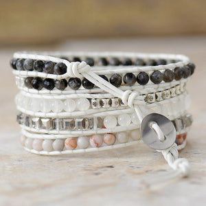 Wrap-around bracelet with white leather, geode stones, and silver beads.