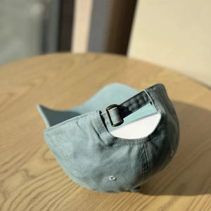 Light blue baseball cap with adjustable strap and buckle closure
