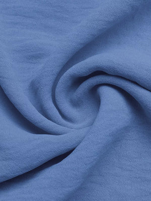 Blue textured fabric detail of maternity romper