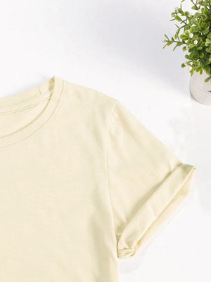 Light yellow t-shirt with rolled short sleeves and a crew neck.