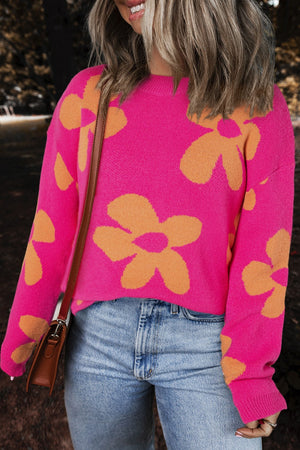 Cerise oversized knit sweater with orange floral pattern, crew neck, long sleeves.