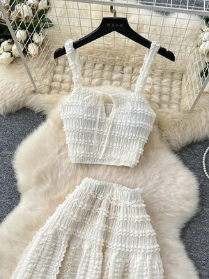 White ruched crop top with tie detail and tiered maxi skirt set.