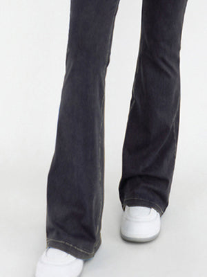 Charcoal crossover waist flare jeans with a bootcut leg and contrast stitching.