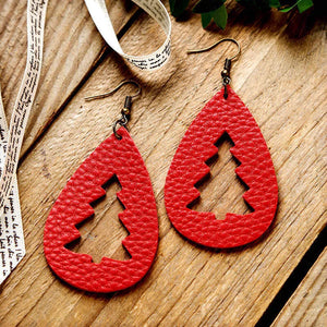 Red teardrop earrings with tree cutouts and bronze hooks