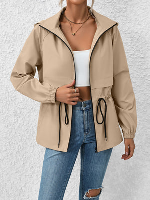Khaki utility jacket with drawstring waist and hood, zip front, elastic cuffs.