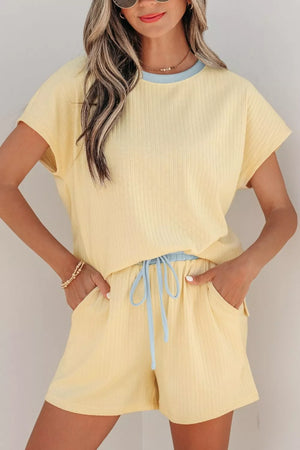 Yellow ribbed cotton two-piece set with crew neck top and drawstring shorts, light blue trim.