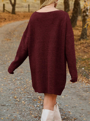 Burgundy ribbed knit oversized mini dress with boat neck and long sleeves.