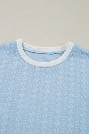Light blue cable knit loungewear top with contrast white trim neckline
