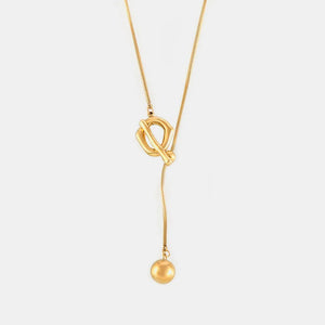 Gold lariat necklace with toggle closure and ball pendant
