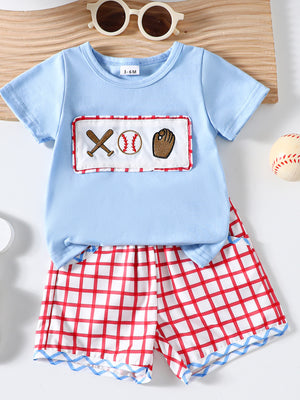 Baby blue cotton baseball top with embroidered baseball graphics and red plaid shorts.