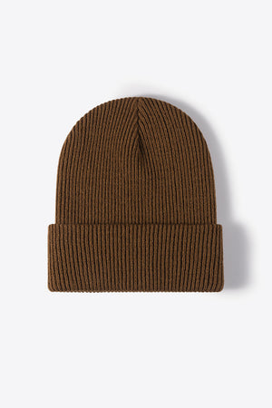 Brown ribbed knit beanie made of acrylic with a cuffed hem.