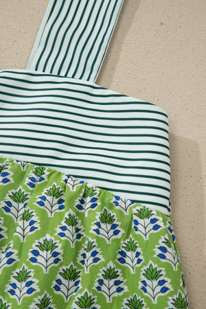 Floral tie-strap tank top with square neckline, green and white stripes and blue floral print.
