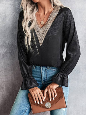 Black satin blouse with lace inset V-neck and ruffle cuffs
