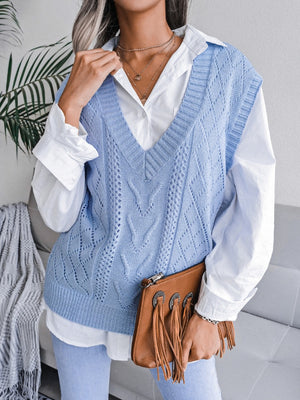 Light blue openwork cable knit vest with V-neck and diamond pattern, acrylic.