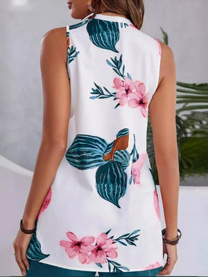 White floral v-neck sleeveless top with teal shorts set.