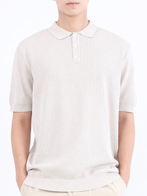 Beige textured knit polo shirt with classic collar and short sleeves.