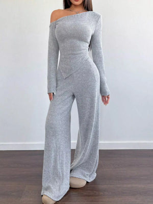 Light gray ribbed knit one-shoulder long sleeve top with asymmetric hem and wide leg pants set.