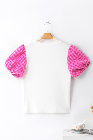 White ribbed knit blouse with pink houndstooth puff sleeves