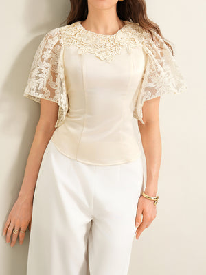 Apricot lace trimmed short sleeve blouse with floral lace neckline and flutter sleeves.