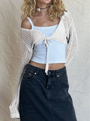 Crochet tie-front bolero shrug in black, white, or dusty blue acrylic.
