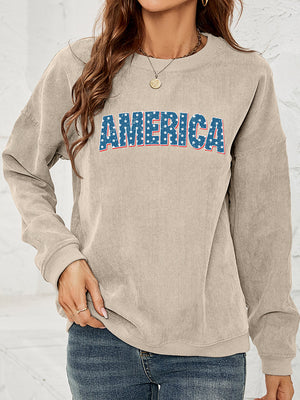 Sand corduroy sweatshirt with blue distressed "AMERICA" graphic with stars