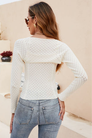 Cream open-knit bolero sleeve top with diamond pattern detail.