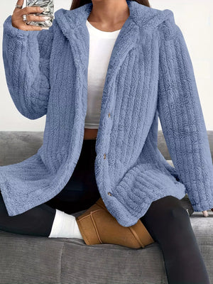 Blue button-up fleece jacket with a hood and cozy texture