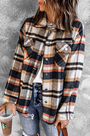 Soft plaid shacket with patch pockets in brown, black, white, and orange.