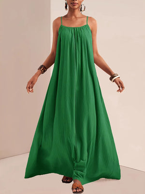 Green maxi swim dress with spaghetti straps and a gathered neckline.