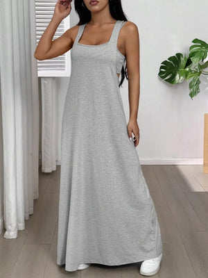 Gray scoop neck cami maxi dress with a relaxed fit and side cutouts.