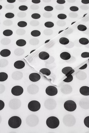 White polka dot mesh mock neck shirt with sheer fabric and long sleeves.