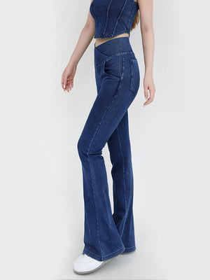 Crossover waist flare jeans in medium wash denim with a flared leg and a subtle V-shaped waistband detail.