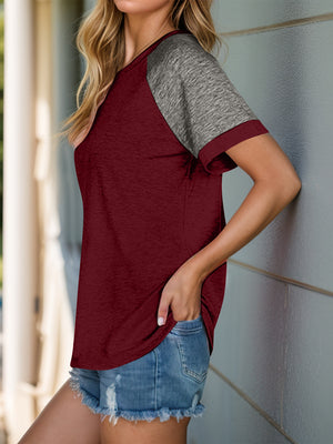 Burgundy raglan sleeve tee with heather gray sleeves and a casual fit.