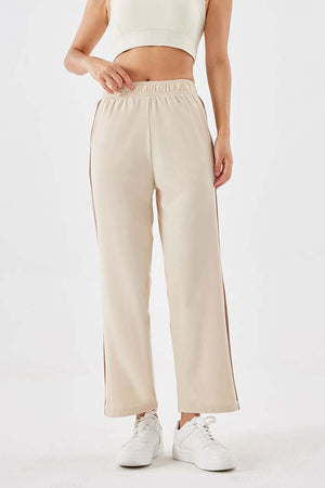 Side stripe relaxed trousers in camel with a comfortable elastic waistband and wide leg.