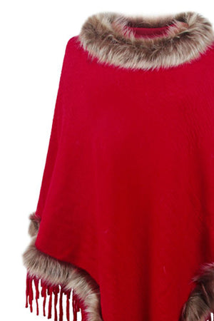 Deep Red knit poncho with faux fur trim and fringe detail