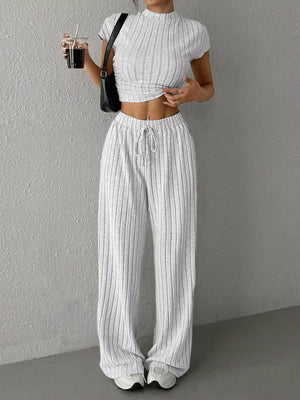 Ribbed knit set with mock neck crop top and wide leg drawstring pants, grey pinstripe pattern.